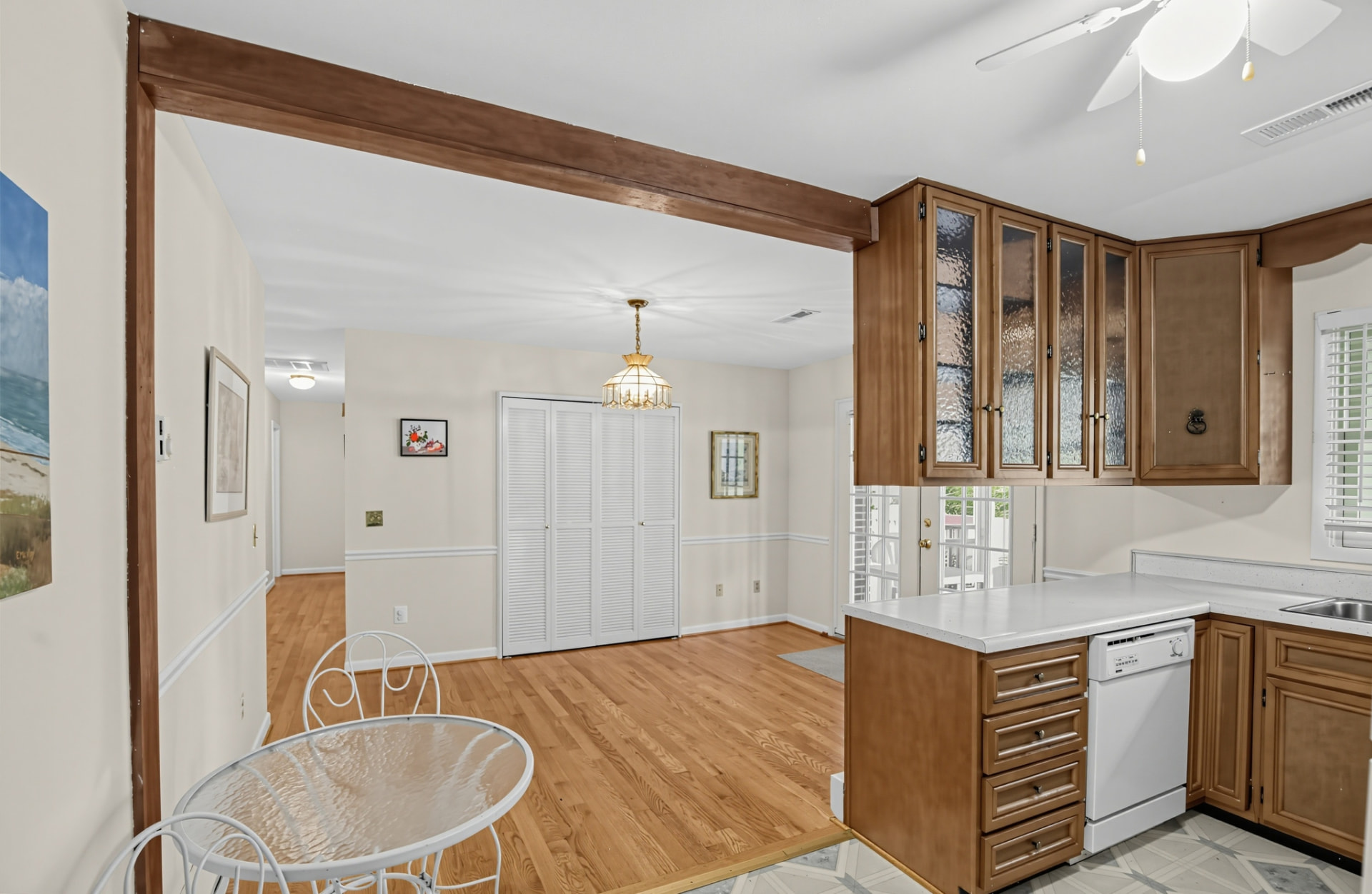 Unfurnished kitchen with wood cabinetry and dining area